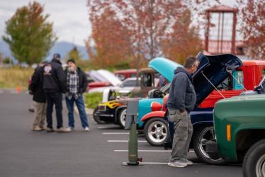 Rathdrum Rumble car show attendees gather and view vehicles on Sept. 30, 2023, at NIC’s Parker Technical Education Center in Rathdrum.